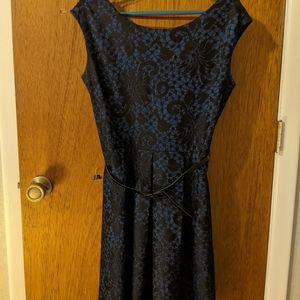 Navy cocktail dress with lace overlay detailing
